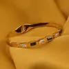 Bratara cupru placat cu aur galben 18k cu zirconii dreptunghiulare baguette albe si negre, imagine 2