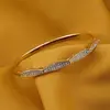 Bratara cupru placat cu aur galben 18k model valuri si zirconii, imagine 2