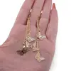 Cercei atarnatori Cupru placat cu Aur galben 14k, cu fluturasi, imagine 3