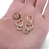 Cercei Cupru placat cu Aur galben 14k, model inimi impletite cu zirconii, imagine 3