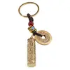Breloc feng shui cu Roata de rugaciuni tibetane pentru protectie si binecuvantare, 10cm