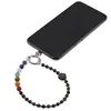 Accesoriu pentru telefon Obsidian auriu, cristale 7 chakre si labuta gravata