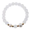 Bratara pe elastic Perle de cultura, bumbi aurii si Selenit sfere 8mm