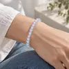 Bratara din opalit cu sfere de 6 mm, pe elastic, lungime 19 cm – imagine de prezentare în context