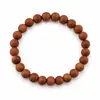 Bratara goldstone cu sfere mate de 8 mm, elastic, lungime 19 cm – produs pe fundal alb