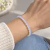 Bratara cu opalit artificial, sfere de 4 mm, pe elastic, lungime 19 cm – imagine de prezentare în context