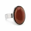Inel reglabil Goldstone maro oval cu montura din inox, 22mm – produs pe fundal alb