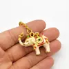 Breloc amuleta cu elefant alb si nestemate