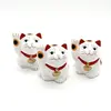 Statueta Feng Shui pisica Maneki Neko alba, din ipsos - 5cm