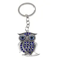 Breloc Bufnita argintie cu cristale albastre si ochi protectori, 10cm