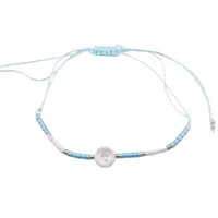 Bratara reglabila cu margele cilindrice bleu si albe cu cruce gravata pe element din Sidef