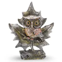 Statueta bufnita argintie pe frunza decorativa, 24cm