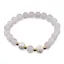 Bratara pe elastic Perle de cultura, bumbi aurii si Cuart roz sfere mate 8mm