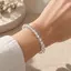 Bratara din cristal de stanca, sfere de 6 mm, pe elastic, lungime 19 cm – imagine de prezentare în context